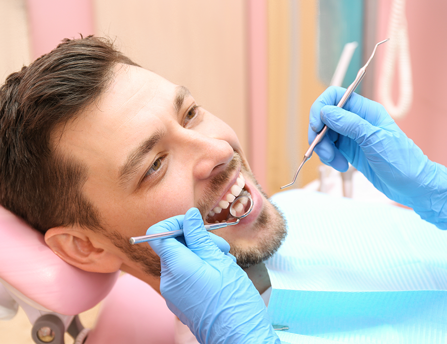 Smiling man receiving porcelain veneers in Daly City, CA.